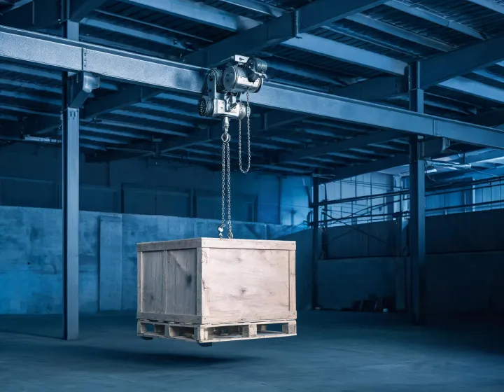 Hand chain hoist on a warehouse I-beam, illustration only